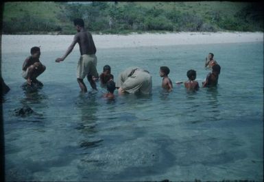 Raku boys playing in the sea : Port Moresby, Papua New Guinea, 1953 / Terence and Margaret Spencer