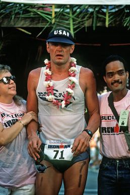 Major (MAJ) Gary Castelli, a member of the US Air Force, catches his breath after completing the 26-mile marathon, part of the 1987 Ironman Competition