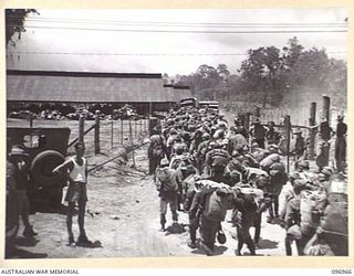 TOROKINA, BOUGAINVILLE. 1945-09-23. JAPANESE NAVAL TROOPS FINISHING THEIR 10-MILE MARCH FROM THE BUKA AREA, ESCORTED BY TROOPS OF 27 INFANTRY BATTALION. THE JAPANESE WERE HANDED OVER TO OFFICERS OF ..