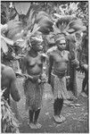 Pig festival, wig ritual: decorated adolescent girls at presentation of wigged men