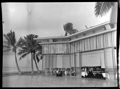 Tables with sun umbrellas at the beach, Honolulu, Hawaii