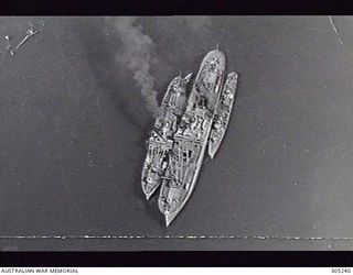 RABAUL, NEW BRITAIN. 1942-05-14. TWO JAPANESE AUXILIARIES AND A TORPEDO BOAT MOORED TOGETHER IN THE HARBOUR. (NAVAL HISTORICAL COLLECTION)
