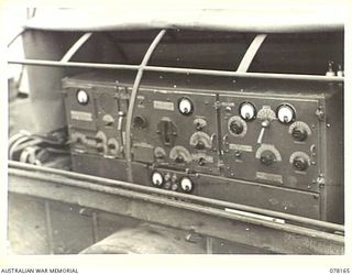 LAE, NEW GUINEA. 1945-01-03. RADIO BROADCASTING AND RECEIVING EQUIPMENT OF THE 34TH WIRELESS TELEGRAPHY SECTION (HEAVY) LOADED ABOARD A JEEP TRAILER OF THE 19TH LINES OF COMMUNICATION SIGNALS
