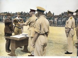 Major General H C H Robertson, GOC 6th Division, at the ceremony at which the Commander of the 18th Japanese Army in New Guinea, Lieutenant General (Lt Gen) Hatazo Adachi, signed the surrender ..