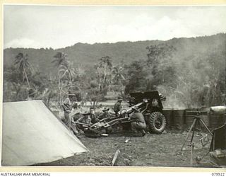 DAGUA, NEW GUINEA. 1945-03-25. A 25 POUNDER GUN OF THE 2/2ND FIELD REGIMENT, ROYAL AUSTRALIAN ARTILLERY, FIRING AT JAPANESE POSITIONS IN THE TORRICELLI RANGES OVERLOOKING THE AIRSTRIP