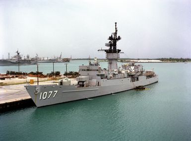 A port bow view of the frigate USS QUELLET (FF 1077) moored in the harbor