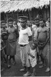 Wanumbil, Wanuma Census Division: man in police cap with child and other men