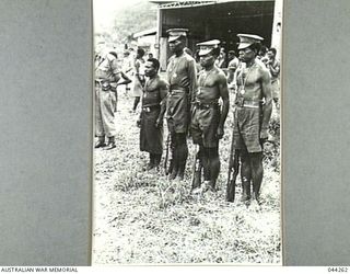 WAU, NEW GUINEA 1943. A GROUP OF NATIVES ON THE OCCASION OF PRESENTATION OF PRIZES TO NATIVE TROOPS BY LT-GEN SIR IVEN MACKAY. (DONATED BY LADY MACKAY)