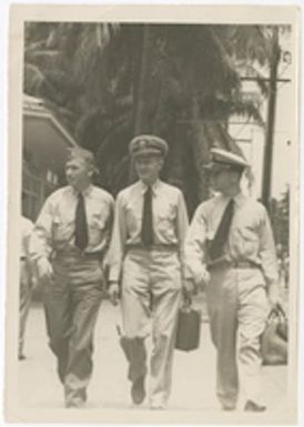 [Remi Charles O'Connor walking with two other servicemen]