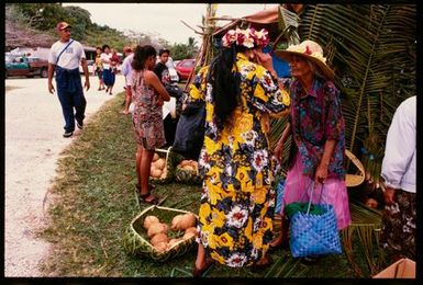 Women with baskets of vegetables, Niue