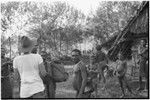 Babimp: Ann Rappaport with Kalam carriers and other people at a house