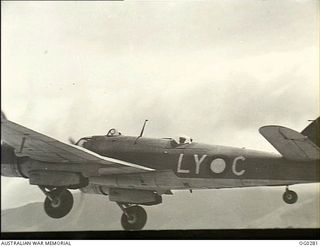 VIVIGANI, GOODENOUGH ISLAND, PAPUA. C. 1943-12-21. A BRISTOL BEAUFIGHTER AIRCRAFT OF NO. 30 SQUADRON RAAF, CODED LY-C, IN FLIGHT OVER GOODENOUGH ISLAND