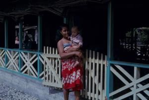 [Woman holds a baby in Safotu, Samoa]