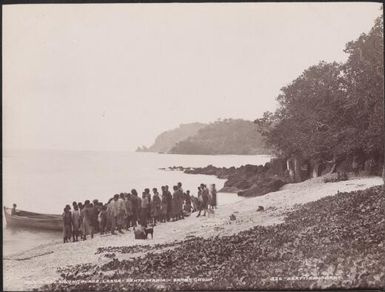 Boats crew and Lakona people on the landing place beach, Santa Maria, Banks Islands, 1906 / J.W. Beattie