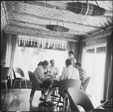 Group of people eating at a table at a hotel, Fiji, 1969 / Michael Terry