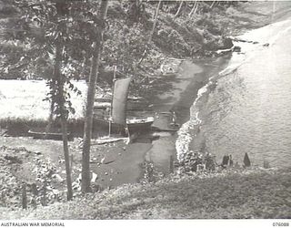 KARKAR ISLAND, NEW GUINEA. 1944-09-19. THE VIEW FROM KUL-KUL PLANTATION SHOWING A PINNACE DAMAGED DURING JAPANESE OCCUPATION AND NOW BEING RE-CONDITIONED BY NATIVES. THE PLANTATION IS NOW UNDER THE ..