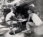 Four soldiers sitting around a table, Bougainville, 1940s