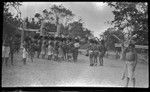 Motu men in circle, drumming and dancing near a dubu platform at Gaile, also spelled Gaire, a village in Central Province