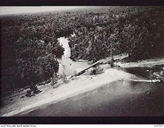 MAMAREGU RIVER AREA, BOUGAINVILLE ISLAND. 1945-07-28. LOOKING SOUTH, PHOTOGRAPH TAKEN BY NO. 5 SQUADRON, RAAF, OF THE BRIDGE OVER THE MAMAREGU RIVER, CONSTRUCTED BY ROYAL AUSTRALIAN ENGINEERS