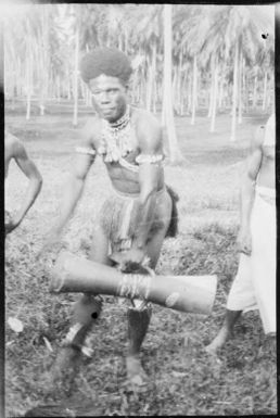 Man playing a hand drum, Awar [?], Sepik River, New Guinea, 1935 / Sarah Chinnery