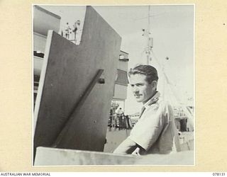 MIOS WUNDI, DUTCH NEW GUINEA. 1944-11-17. LIEUTENANT COMMANDER ROBSON, ROYAL AUSTRALIAN NAVY RESERVE (RANVR), CAPTAIN, ON THE BRIDGE OF THE ROYAL AUSTRALIAN NAVY CORVETTE HMAS GLENELG