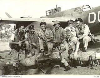 1943-07-16. NEW GUINEA. SOME OF THE PILOTS WHO PARTICIPATED IN THE LARGEST BOMBING RAID ON A LAND TARGET IN THE SOUTHWEST PACIFIC AREA. LEFT TO RIGHT. F/LT. DICK HUNT, OF DOUBLE BAY, N.S.W. F/O. ..