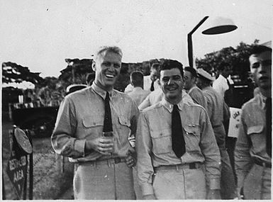 Photograph of Gerald R. Ford, Jr. and Lt. (Junior Grade) W. E. Delaney at the Farewell Party for Air Group at the Ford Island Tennis Club, Pearl Harbor, Hawaii