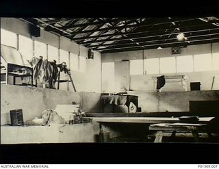 Port Moresby, New Guinea. c. 1942-11. The interior of a new Anti-Aircraft operations room during construction. The walls are lined but the galvanised iron sheets of the roof are still visible ..