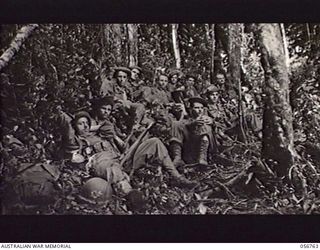 SALAMAUA AREA, NEW GUINEA. 1943-07-23. TROOPS OF THE 1ST BATTALION, 162ND UNITED STATES INFANTRY REGIMENT, RESTING ON THE MOUNT TAMBU TRACK. SHOWN: 20932410 STAFF SERGEANT (S SGT) DICK TROZELL (1); ..