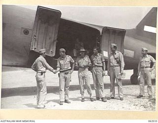 DREGER HARBOUR, NEW GUINEA. 1943-12-07. A DOUGLAS TRANSPORT AIRCRAFT IS THE FIRST LARGE AIRCRAFT TO LAND ON THE NEW STRIP BUILT BY ENGINEERS OF THE 870TH UNITED STATES AVIATION ENGINEER BATTALION. ..