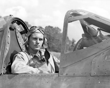 World War II (WWII) era photograph of US Marine Corps (USMC) First Lieutenant (1LT) Paul A. Mullen, taken in the cockpit of a USMC F4U"CORSAIR"aircraft at Guadalcanal, June 6, 1943. 1LT Mullen is an ace pilot and is credited with 6 kills. His hometown is 45 Ordale Boulevard, Pittsburgh, Pennsylvania