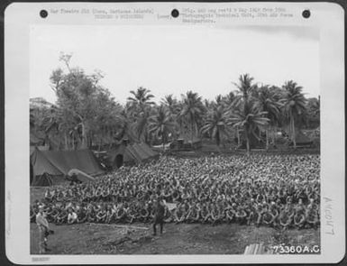 Hundreds Of Japs Seated On The Ground At A Prisoner Of War Camp On Guam, Marianas Islands. 6 September 1945. (U.S. Air Force Number 73360AC)