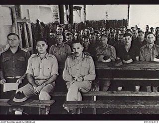 NADZAB, NEW GUINEA, 1944-10. MEMBERS OF THE NEW GUINEA AIR WARNING WIRELESS COMPANY (NGAWW) ATTENDING A CHURCH SERVICE. FRONT ROW, LEFT TO RIGHT: LIEUTENANT ARNOLD, CAPTAIN MARSH, MAJOR L.W. ..