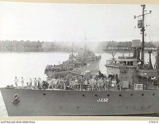 POTSDAM, NEW GUINEA. 1944-08-20. THE RAN CORVETTE HMAS DELORAINE (FRONT) PASSING THE CORVETTE HMAS COLAC AS SHE PULLS INTO THE HARBOUR LOADED WITH TROOPS OF THE 25TH INFANTRY BATTALION