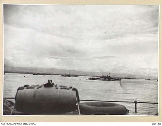 TOROKINA AREA, BOUGAINVILLE, SOLOMON ISLANDS. 1944-12-06. A SECTION OF THE CONVOY IN EMPRESS AUGUSTA BAY VIEWED FROM HMAS WESTRALIA