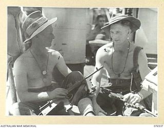 AT SEA. 1944-10-07. VX23821 CORPORAL H.J. WEBSTER (1); VX26176 CORPORAL J.J. DEMPSEY (2), 28TH MALARIA CONTROL UNIT ABOARD THE DUTCH TROOPSHIP, "SWARTENHONDT" WHILE EN ROUTE FOR NEW BRITAIN