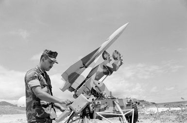 Lance Corporal Martinaz, assigned to Battery C, checks a Hawk surface-to-air missile being used in support of Operation KERNAL BLITZ