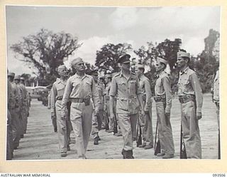 TOROKINA, BOUGAINVILLE. 1945-07-03. HIS ROYAL HIGHNESS, THE DUKE OF GLOUCESTER, GOVERNOR-GENERAL OF AUSTRALIA (1), ACCOMPANIED BY CAPTAIN R.W. BAILE, GUARD COMMANDER, INSPECTING 1 MARINE AIR WING, ..