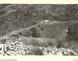 PORT MORESBY, PAPUA, NEW GUINEA. 1944-03-27. NO.1 GUN BOOTLESS BATTERY, COAST ARTILLERY VIEWED FROM NO.2 GUN AT THE BATTERY