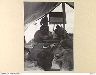 BORAM BEACH, WEWAK AREA, NEW GUINEA. 1945-08-30. TROOPS OF HEADQUARTERS 8 INFANTRY BRIGADE ATTENDING THE ARMY EDUCATIONAL CLASS