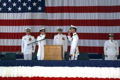 US Navy (USN) Commanders (CDR) Douglas J. McIlraith and David N. Valente exchange a salute in observance of the passing of command of the Fleet Logistics Support Squadron 51 (VR-51), Windjammers, Marine Corps Air Station (MCAS) Kaneohe Bay, Hawaii (HI)