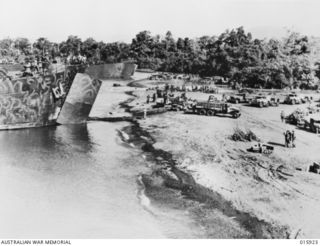 Lae, New Guinea. 1943-09. Landing ships waiting to be loaded with Australian troops and equipment for an attack in the Finschhafen area