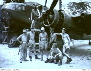 THE SOLOMON ISLANDS, 1945. AUSTRALIAN, NEW ZEALAND AND USA AIRMEN AT TOROKINA WITH A BRISTOL BEAUFORT AIRCRAFT OF NO 10 LOCAL AIR SUPPLY UNIT, RAAF, WHICH WAS BEING SERVICED. (RNZAF OFFICIAL ..