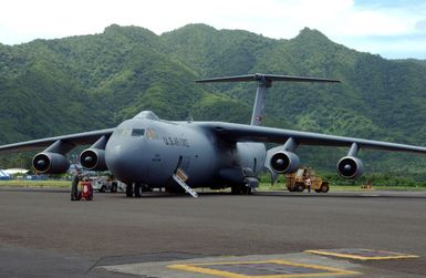 A U.S. Air Force C-141C Starlifter cargo aircraft is refueled while waiting to unload cargo during Operation Deep Freeze, at Pago Pago Airport, American Samoa, on Jan. 17, 2005. (U.S. Air Force PHOTO by TECH. SGT. Joe Zuccaro) (Released)