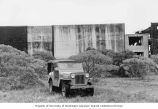 Jeep parked in front of a blockhouse on Enjebi Island, summer 1964