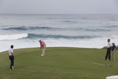 Barack Obama plays golf with Prime Minister Najib Razak, Joe Paulsen, and Mike Brush in Kaneohe Bay, Hawaii, December 24, 2014