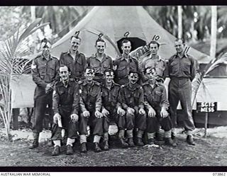 MADANG, NEW GUINEA. 1944-06-15. THE SERGEANTS' MESS AT HEADQUARTERS 15TH INFANTRY BRIGADE. THE UNIT IS LOCATED AT SIAR PLANTATION. LEFT TO RIGHT: FRONT ROW: VX106354 SERGEANT L. R. MORRISON; ..