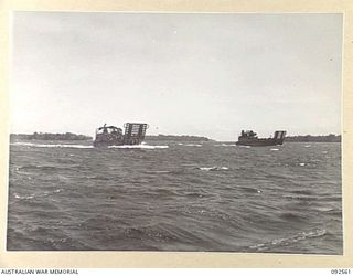 BOUGAINVILLE. 1945-05-25. TROOPS OF 42 LANDING CRAFT COMPANY CARRYING 31/51 INFANTRY BATTALION TROOPS MOVING INTO SHORE FOR THE LANDING ON THE BEACH AT SORAKEN PENINSULA