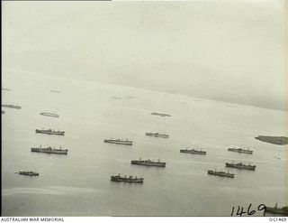 MILNE BAY, PAPUA. C. 1944-02. AERIAL VIEW OF SHIPPING IN MILNE BAY, AS SEEN FROM A BEAUFORT BOMBER AIRCRAFT OF NO. 8 SQUADRON RAAF ON ANTI-SUBMARINE PATROL
