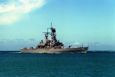 Crew members man the rails as the nuclear-powered guided missile cruiser USS ARKANSAS (CGN 41) approaches Naval Station, Pearl Harbor, Hawaii